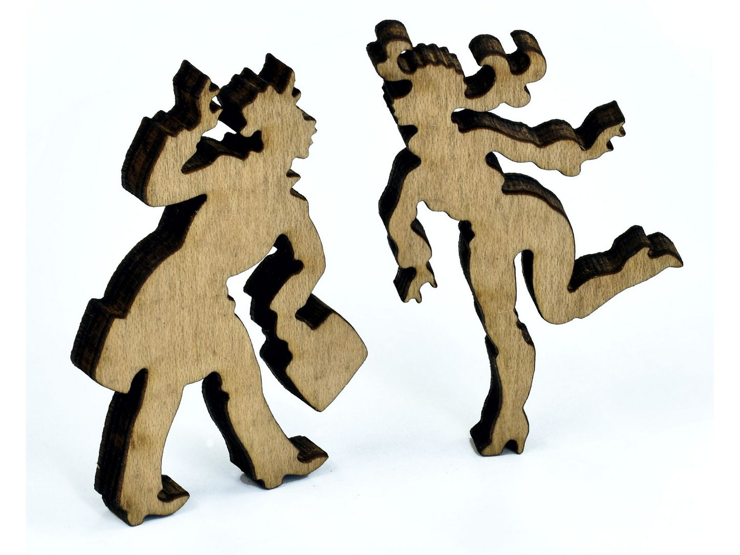 A closeup of pieces in the shape of of two people.