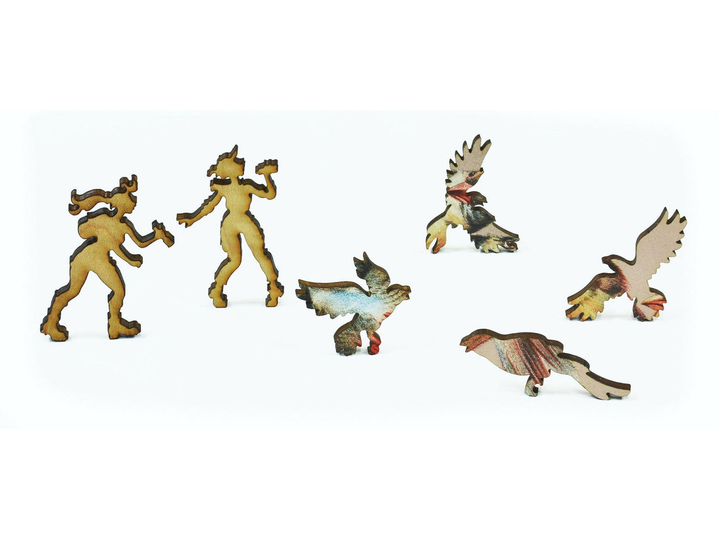 A closeup of pieces in the shape of birdwatchers and birds.