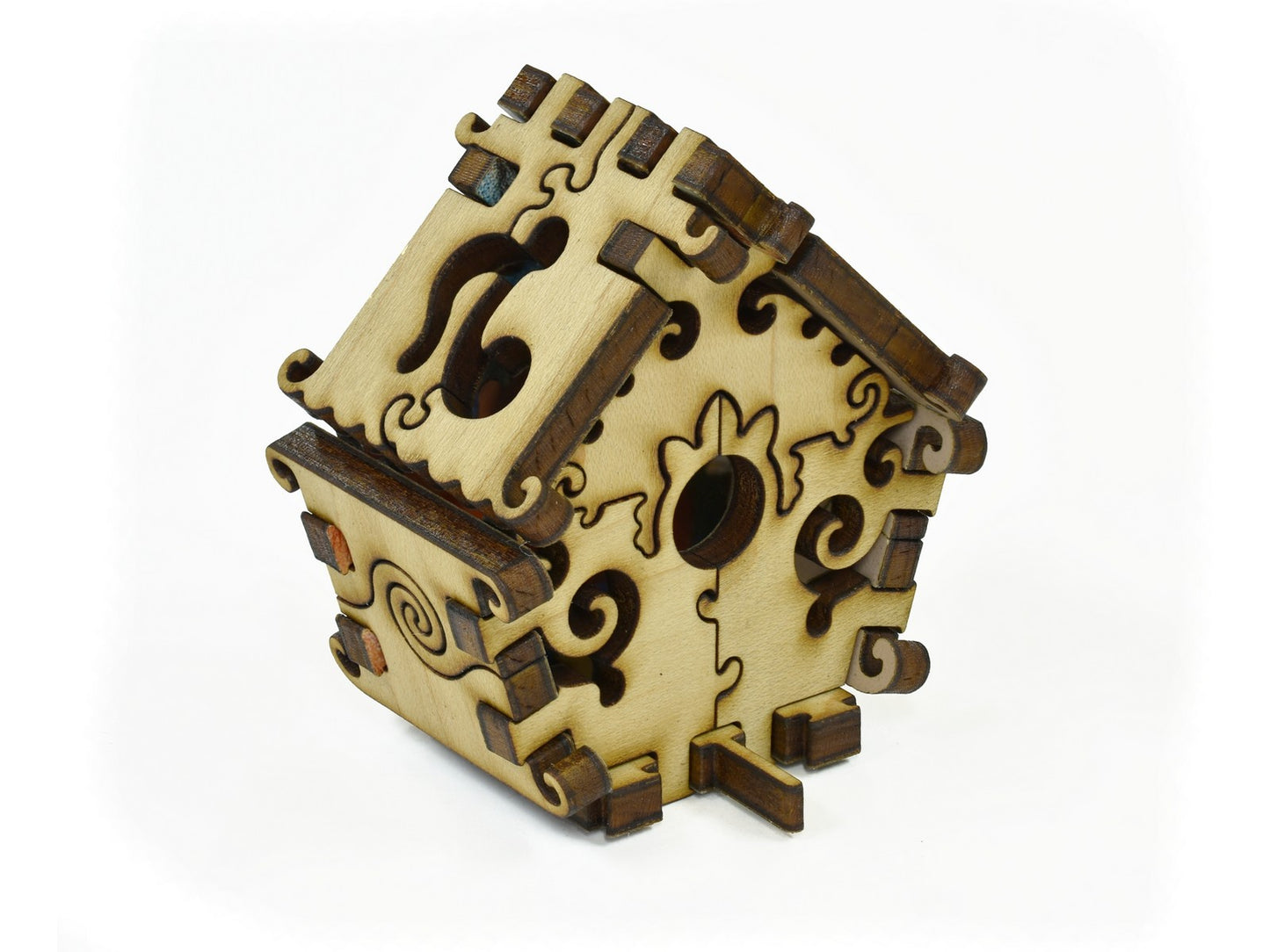 A closeup of pieces in the shape of a 3D Birdhouse.