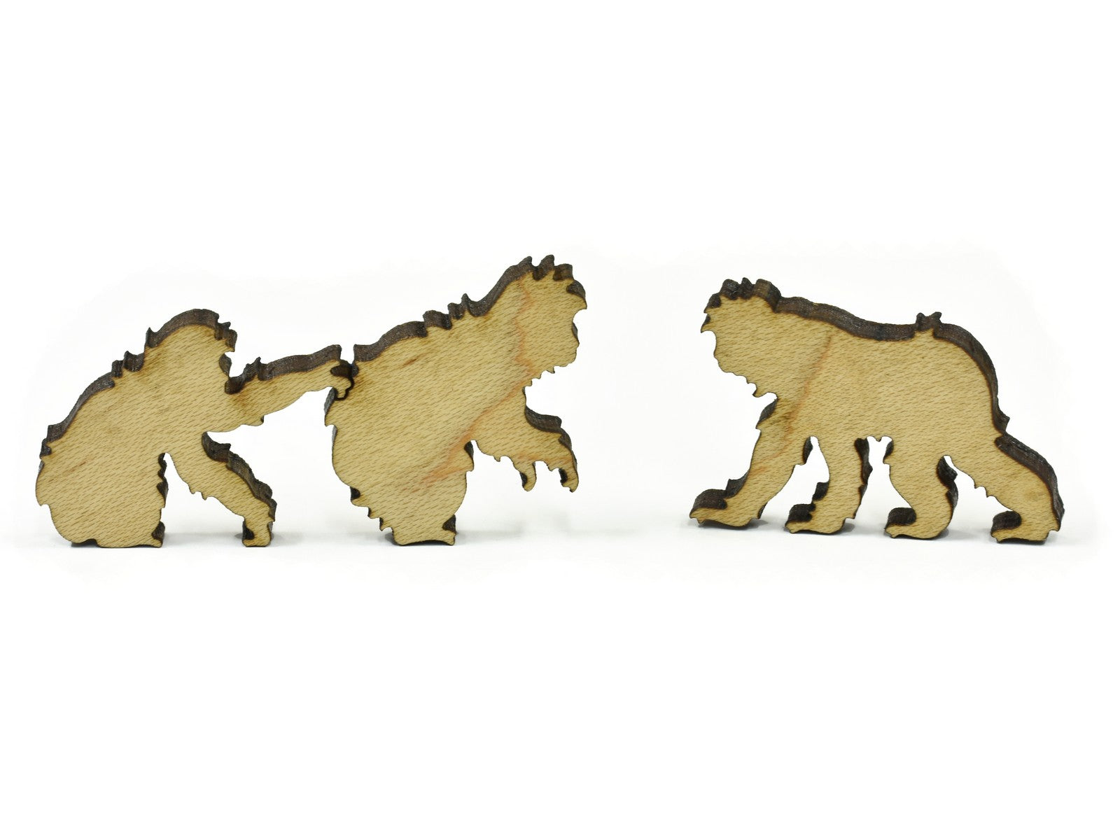 A closeup of pieces in the shape of monkeys.