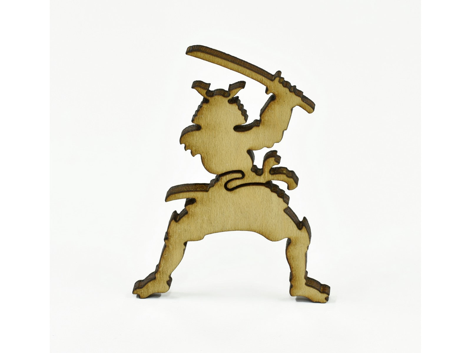 A closeup of pieces in the shape of a samurai.