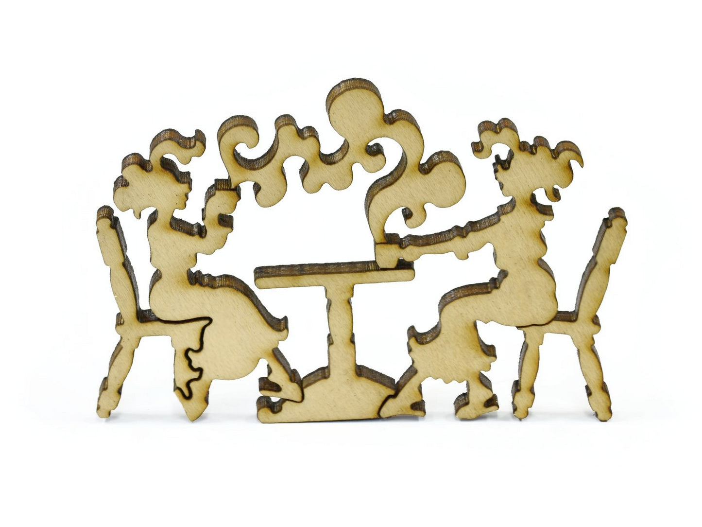 A closeup of pieces in the shape of two people sitting at a table.