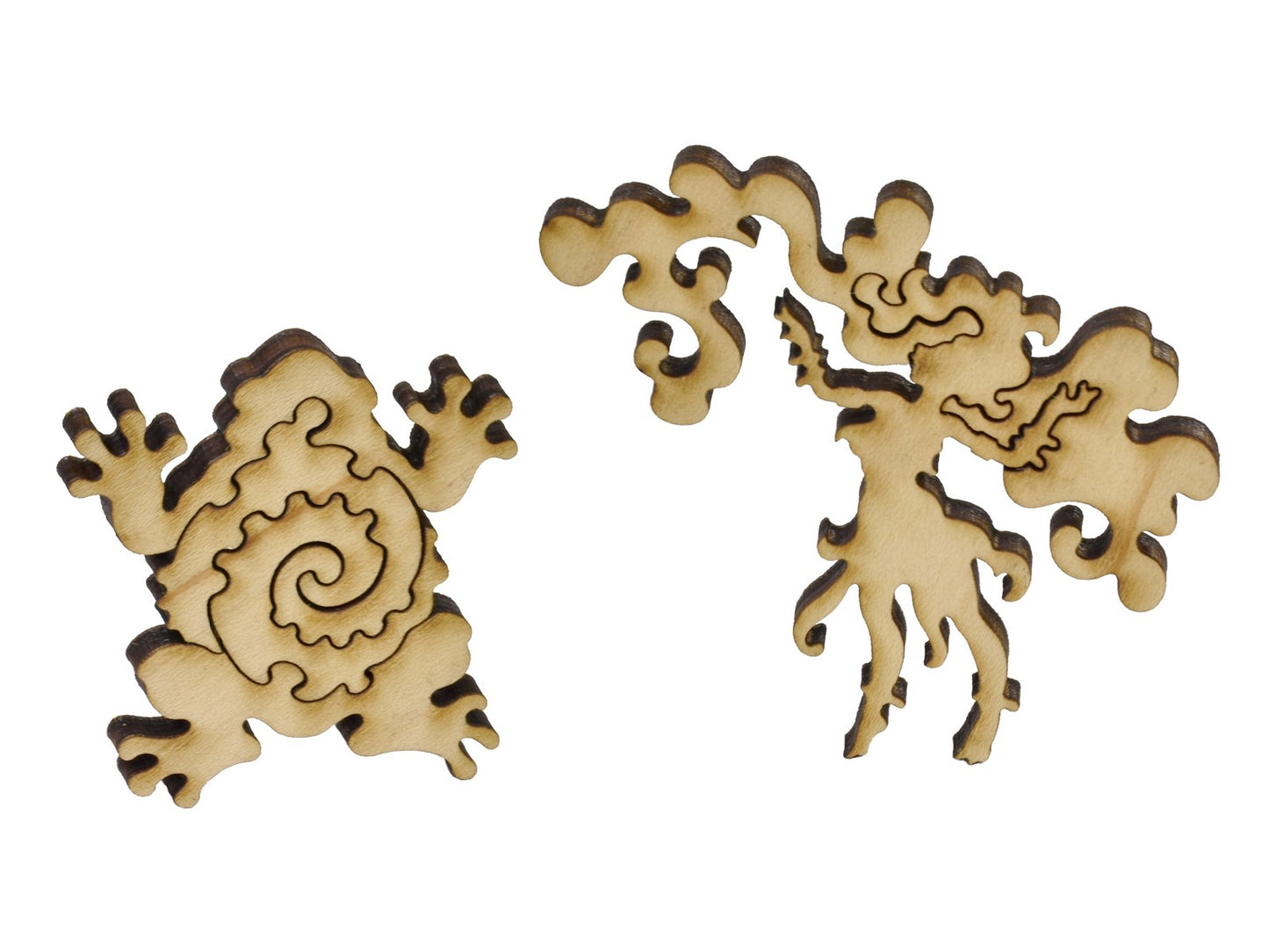 A closeup of pieces in the shape of a frog and a woman.