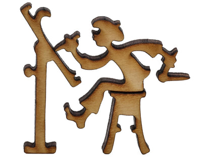  A closeup of pieces shaped like an artist with their easel.