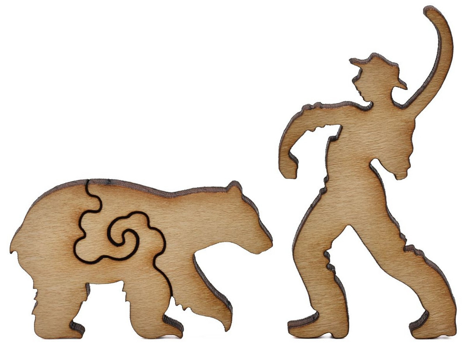 A closeup of pieces shaped like a bear and a fisherman.