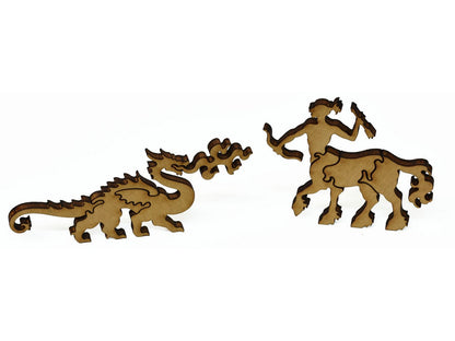 A closeup of pieces showing a centaur and a dragon.
