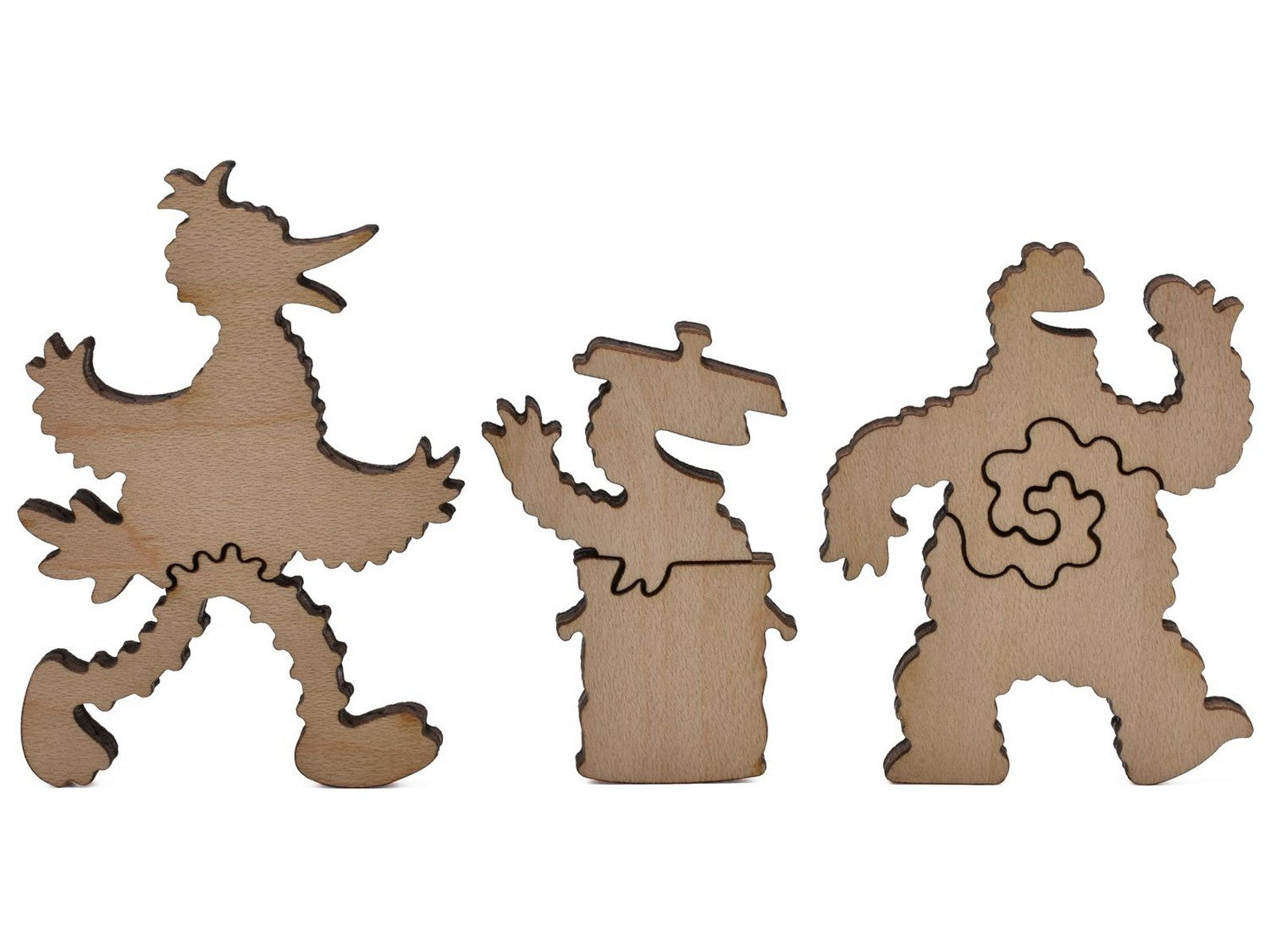 A closeup of pieces shaped like Big Bird, Oscar the Grouch, and Cookie Monster.