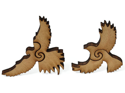 A closeup of pieces showing two birds in flight.