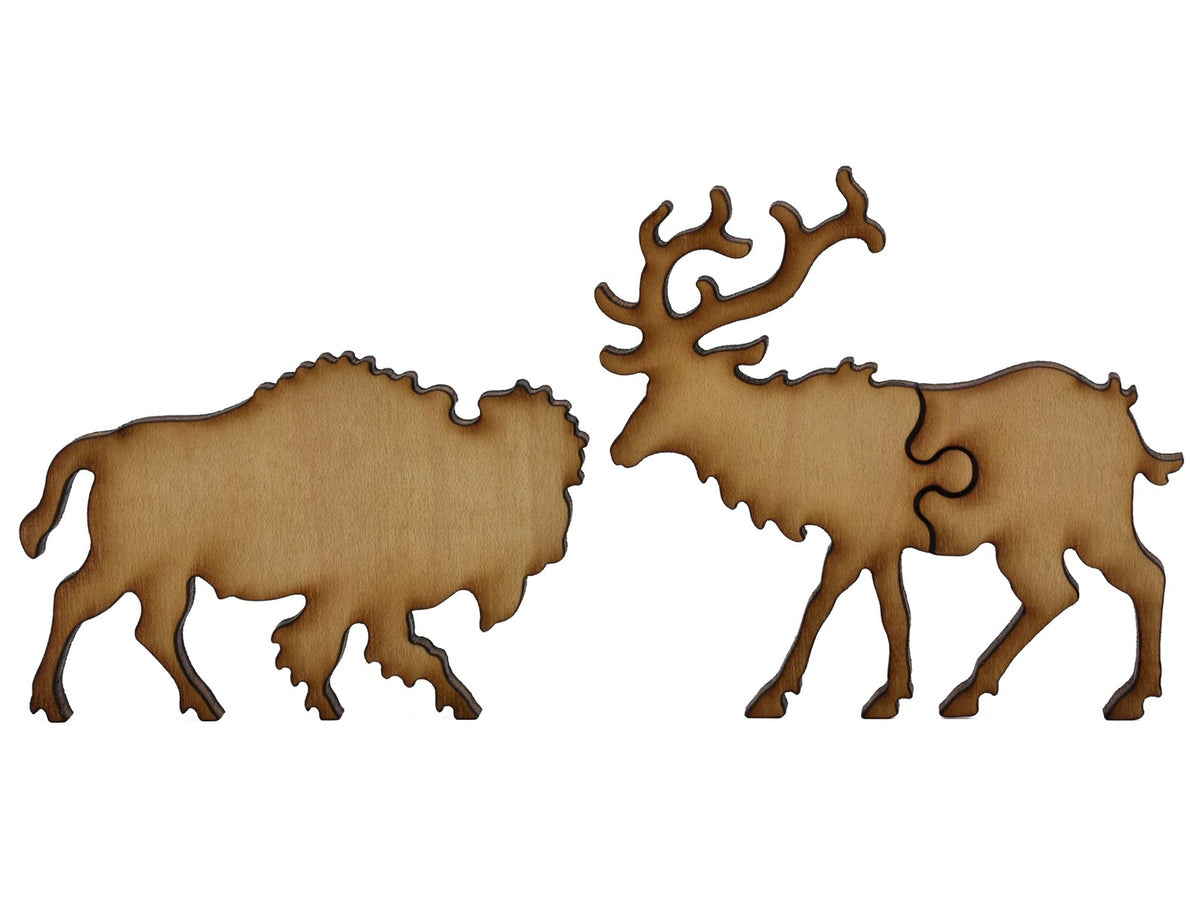 A closeup of pieces shaped like a bison and an elk.