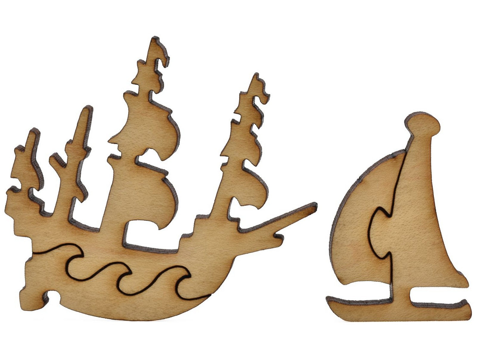 A closeup of pieces shaped like a clipper ship and a sailboat.