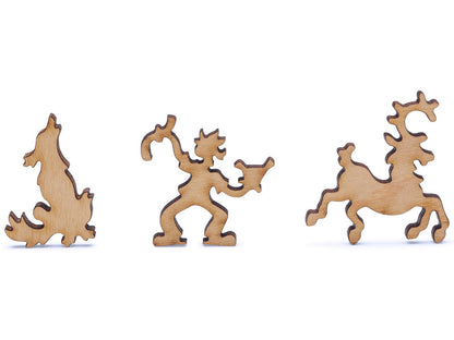 A closeup of pieces shaped like a boy, dog, and reindeer.