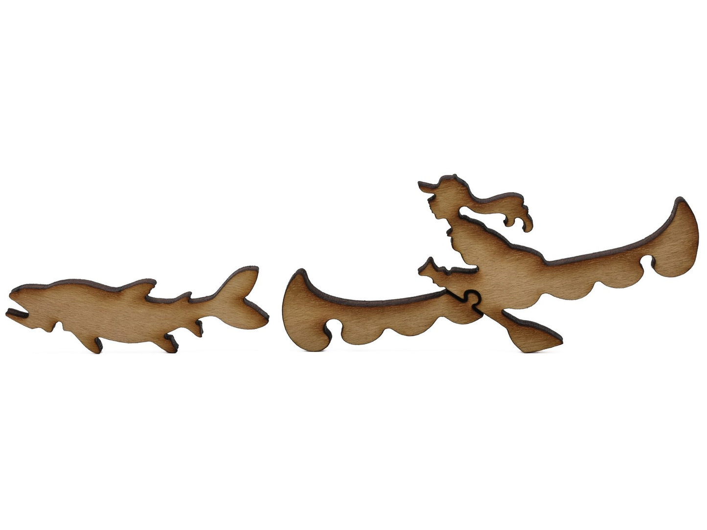 A closeup of pieces shaped like a woman in a canoe and a fish.