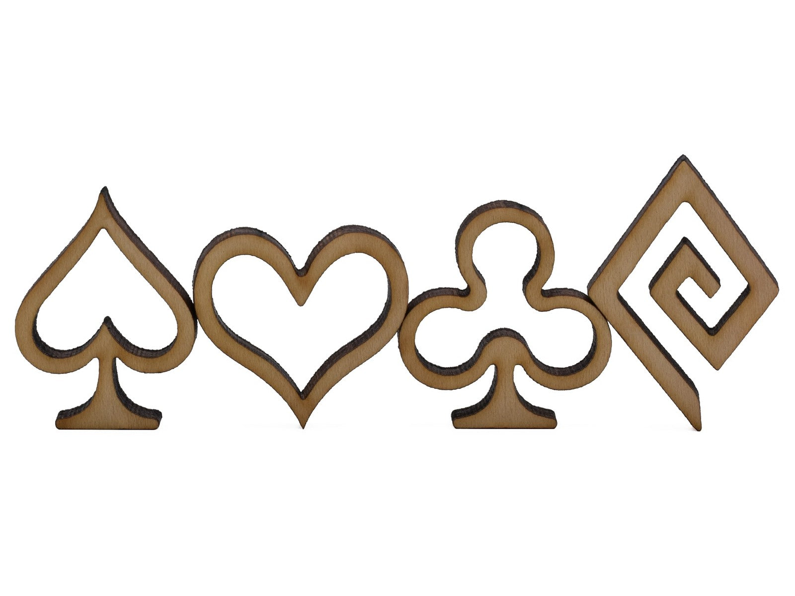 A closeup of pieces shaped like the suits of a deck of cards - spade, heart, club, and diamond.