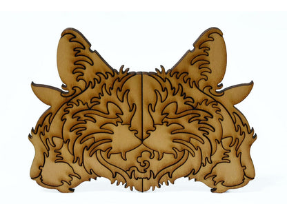 A closeup of pieces shaped like three large cat heads.