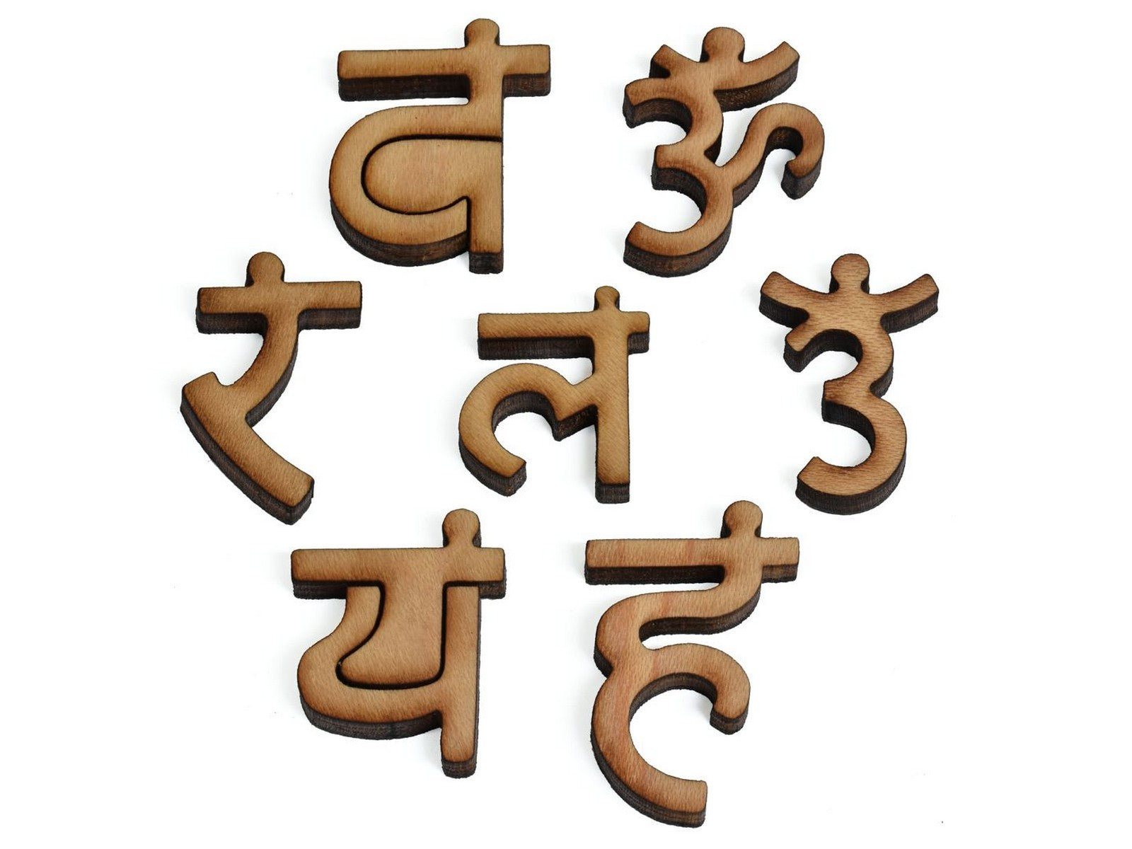 A closeup of pieces showing the Sanskrit letters associated with the seven chakras.
