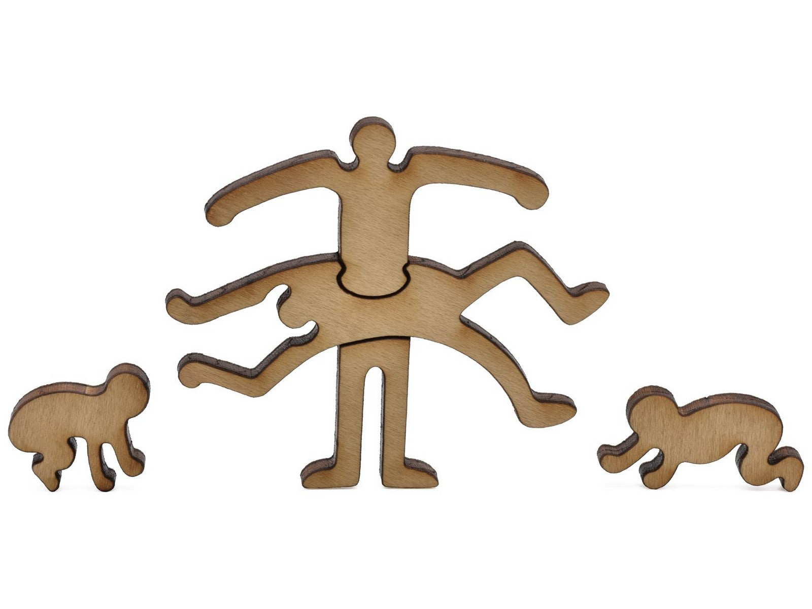 A closeup of pieces in the shape of three Keith Haring figures.