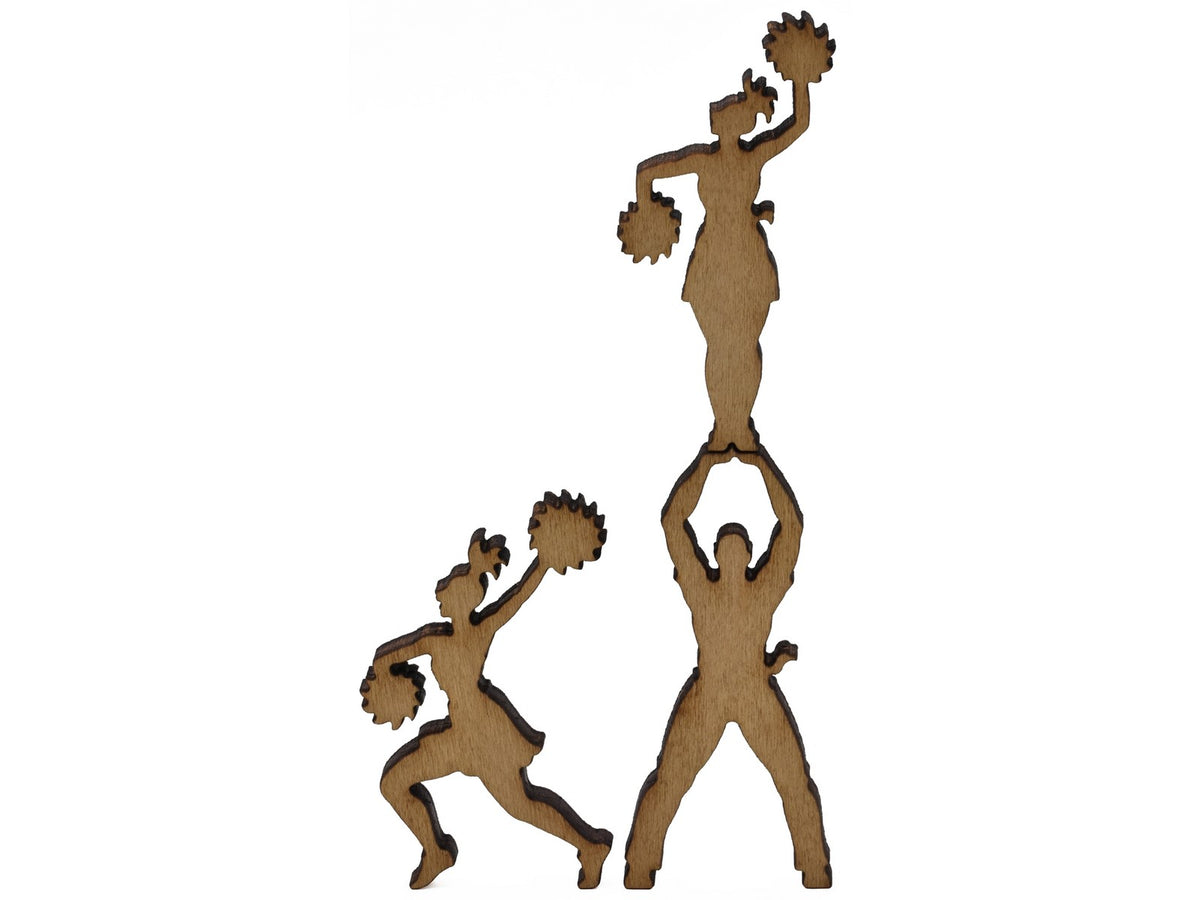 A closeup of pieces shaped like cheerleaders.