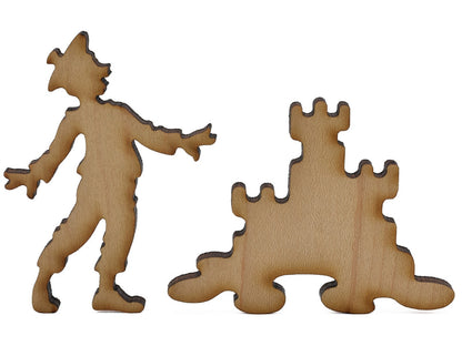 A closeup of pieces shaped like a child and a sand castle.