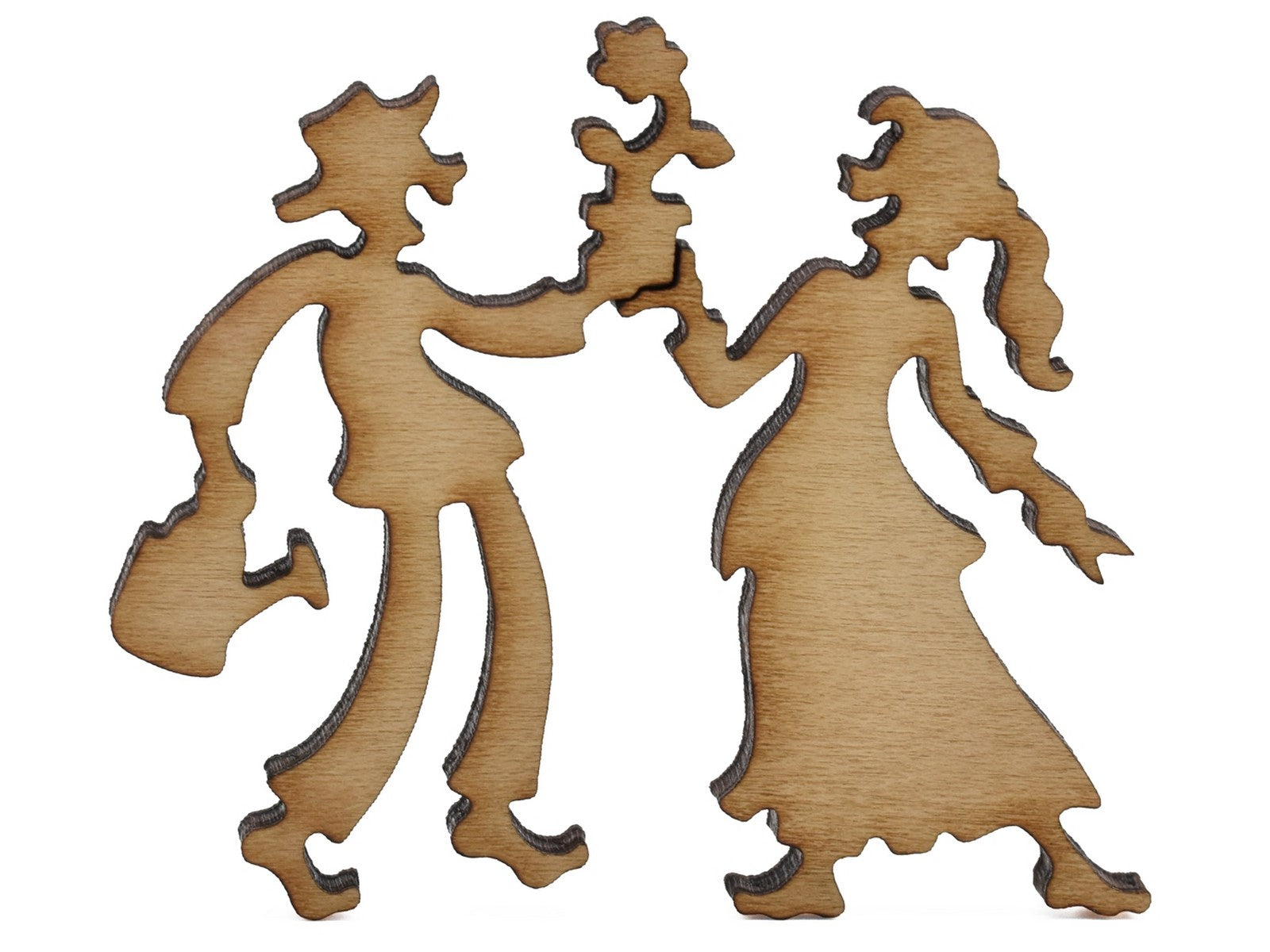 A closeup of pieces shaped like a couple with a flower.