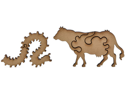 A closeup of pieces shaped like a cow and a large caterpillar.