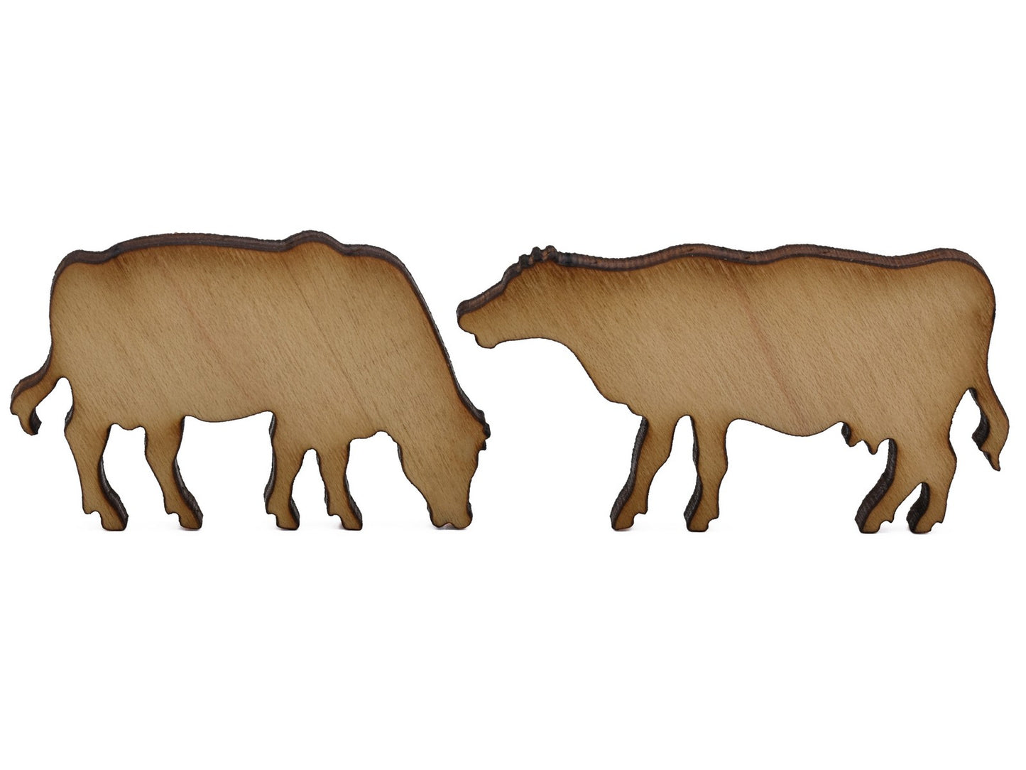 A closeup of pieces shaped like two cows.