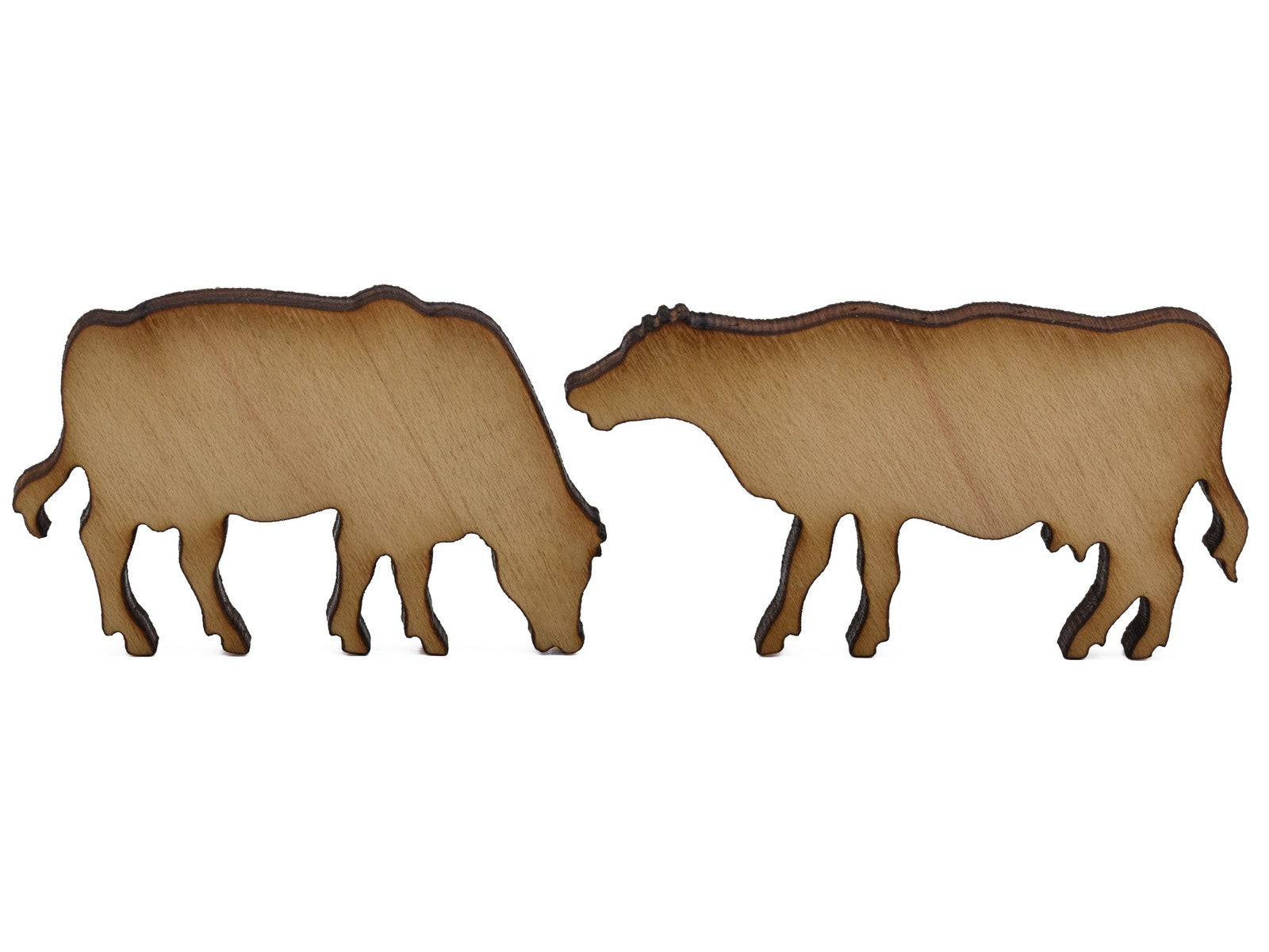 A closeup of pieces shaped like two cows.