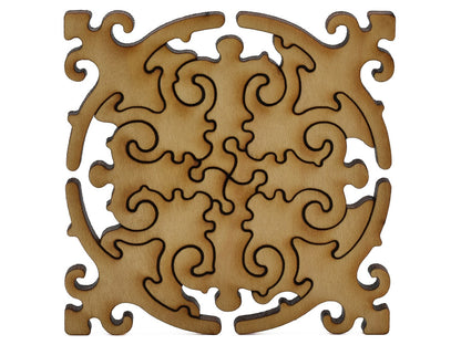 A closeup of pieces shaped like a large multi-piece mandala.