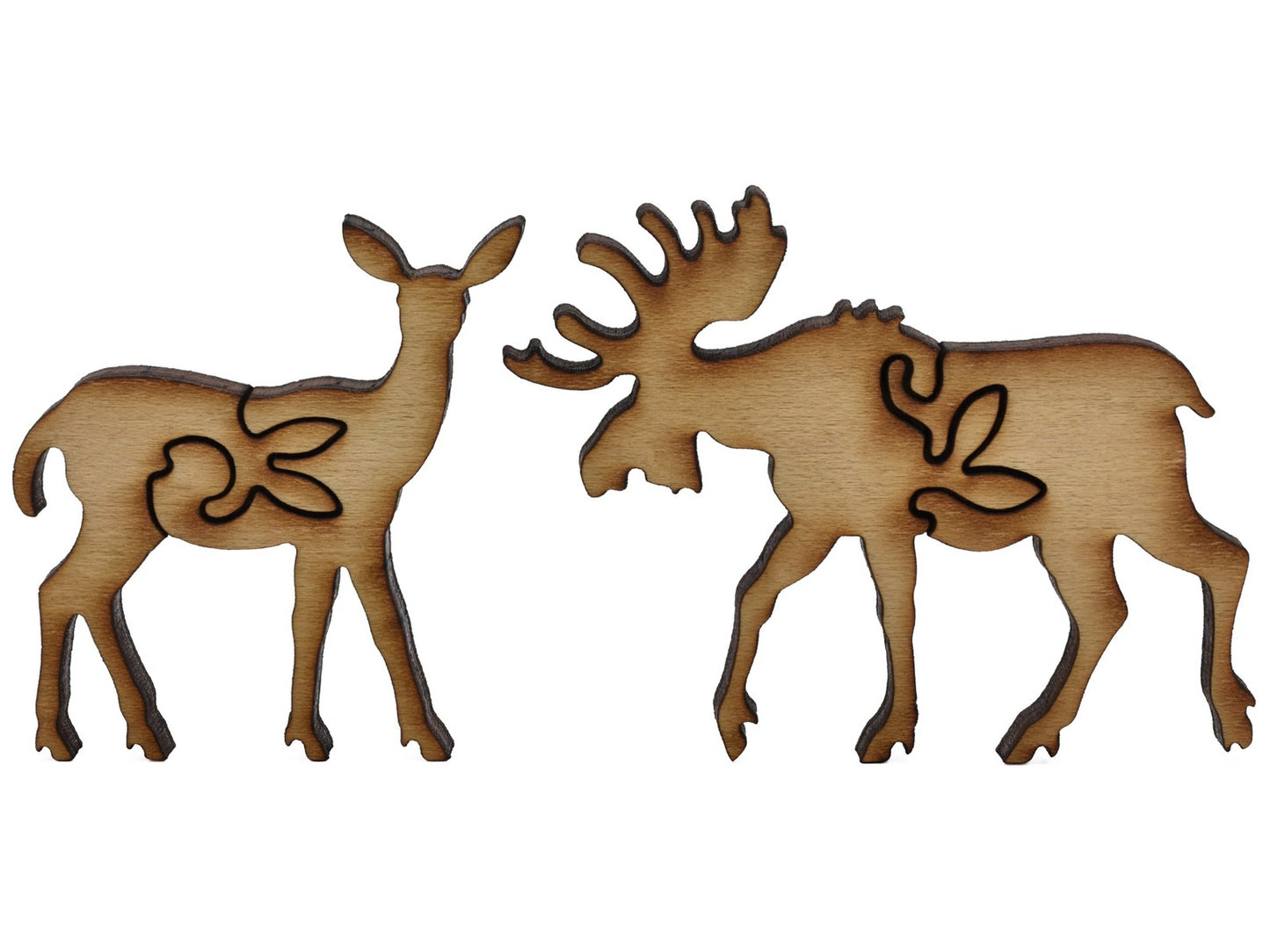 A closeup of pieces shaped like a deer and a moose.