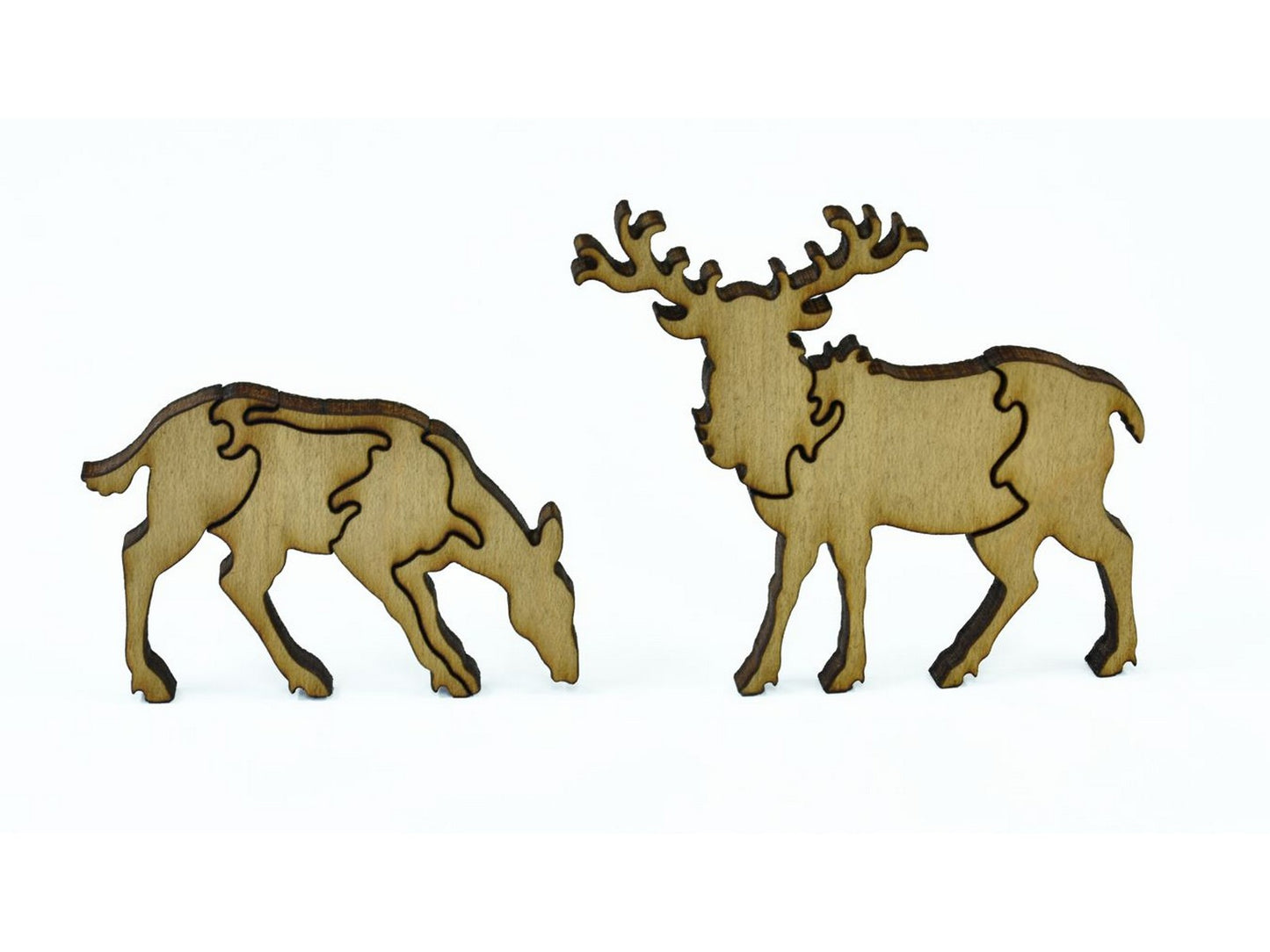 A closeup of pieces in the shape of deer.