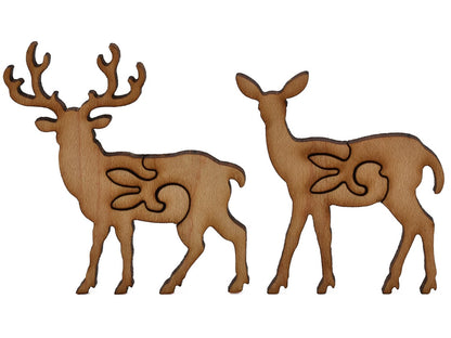 A closeup of pieces shaped like a buck and doe.