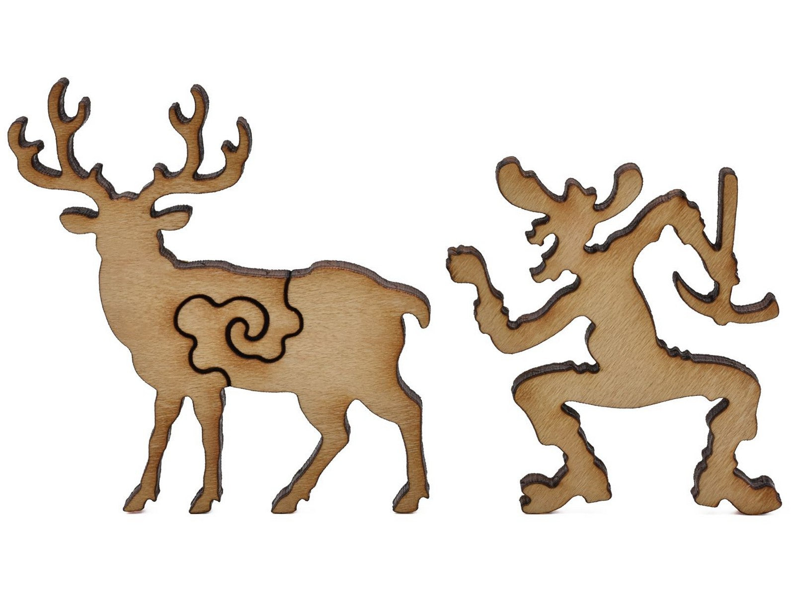 A closeup of pieces shaped like a buck and a miner.