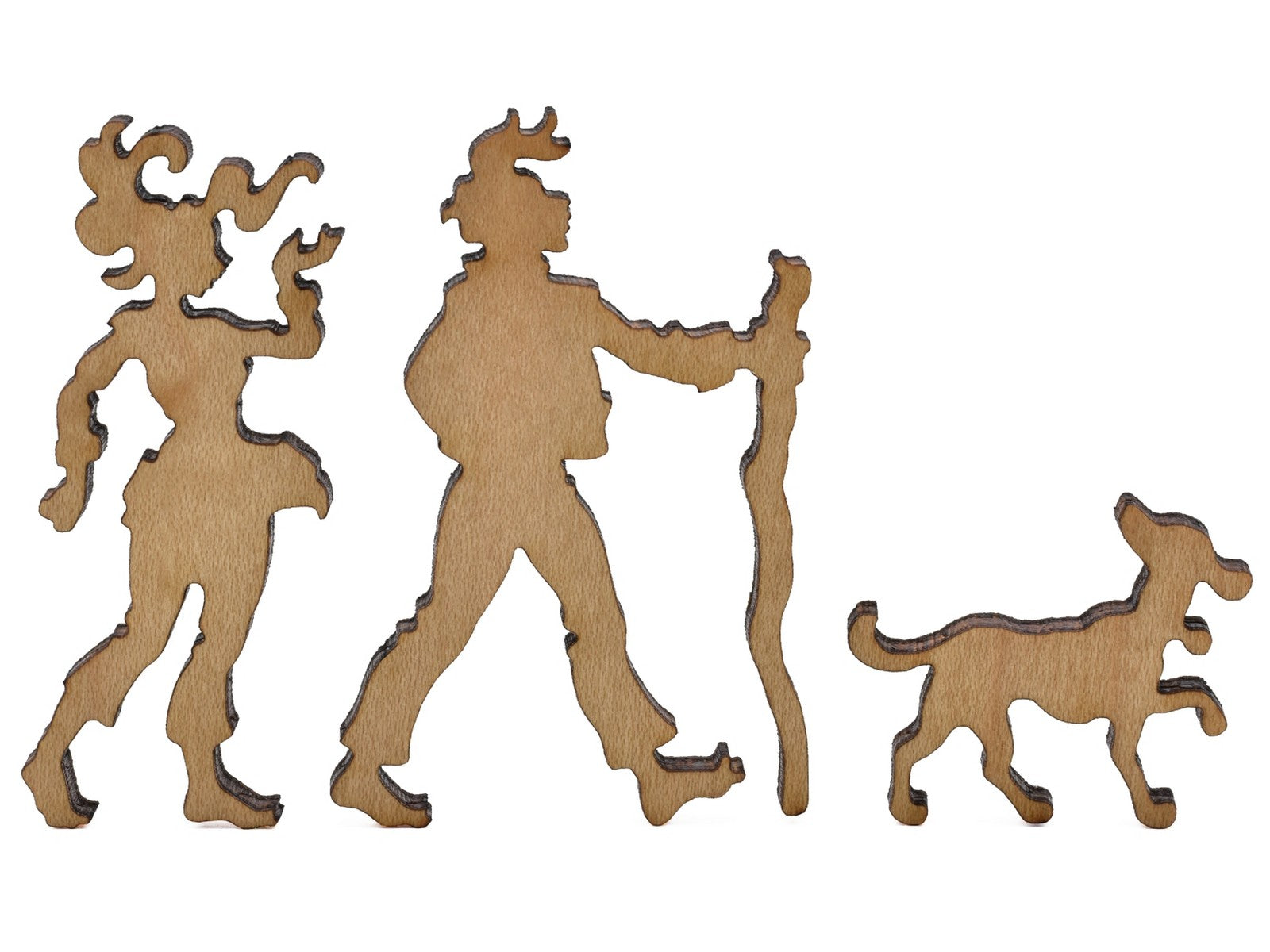 A closeup of pieces shaped like a family taking a hike with a dog.