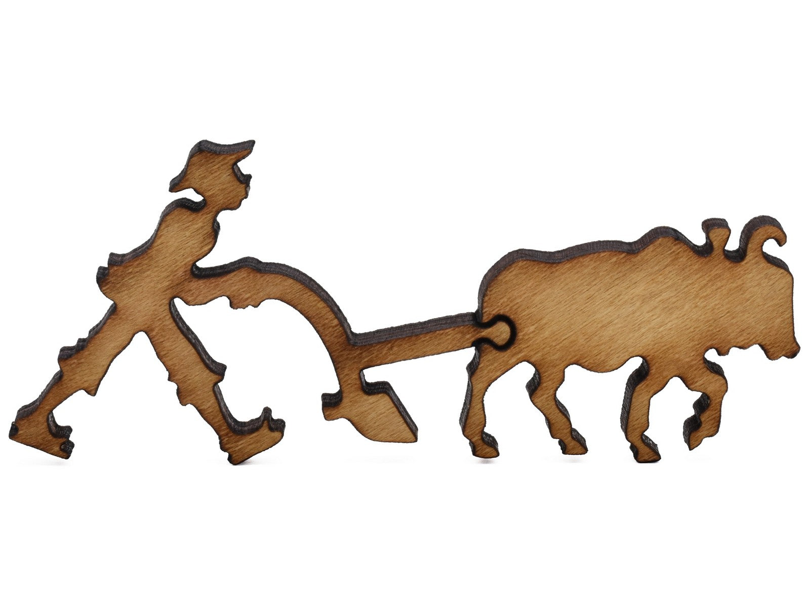 A closeup of pieces shaped like a farmer and an ox.