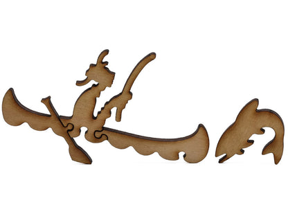 A closeup of pieces shaped like a fisherman in a canoe and a fish.