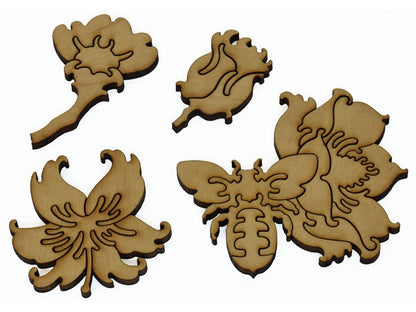 A closeup of pieces showing four multi-piece flowers and a bee.