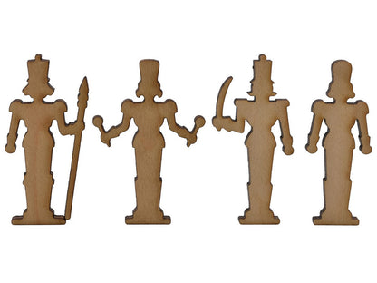 A closeup of pieces shaped like four nutcrackers.