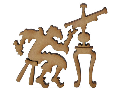 A closeup of pieces shaped like Galileo and a telescope.