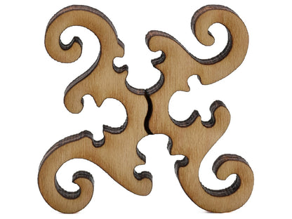 A closeup of pieces shaped like a round geometrical design.