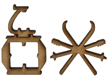 A closeup of pieces shaped like a gondola and skis.