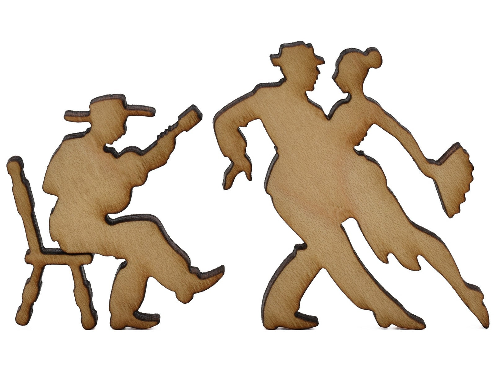 A closeup of pieces shaped like a guitar player and couple tango dancing.