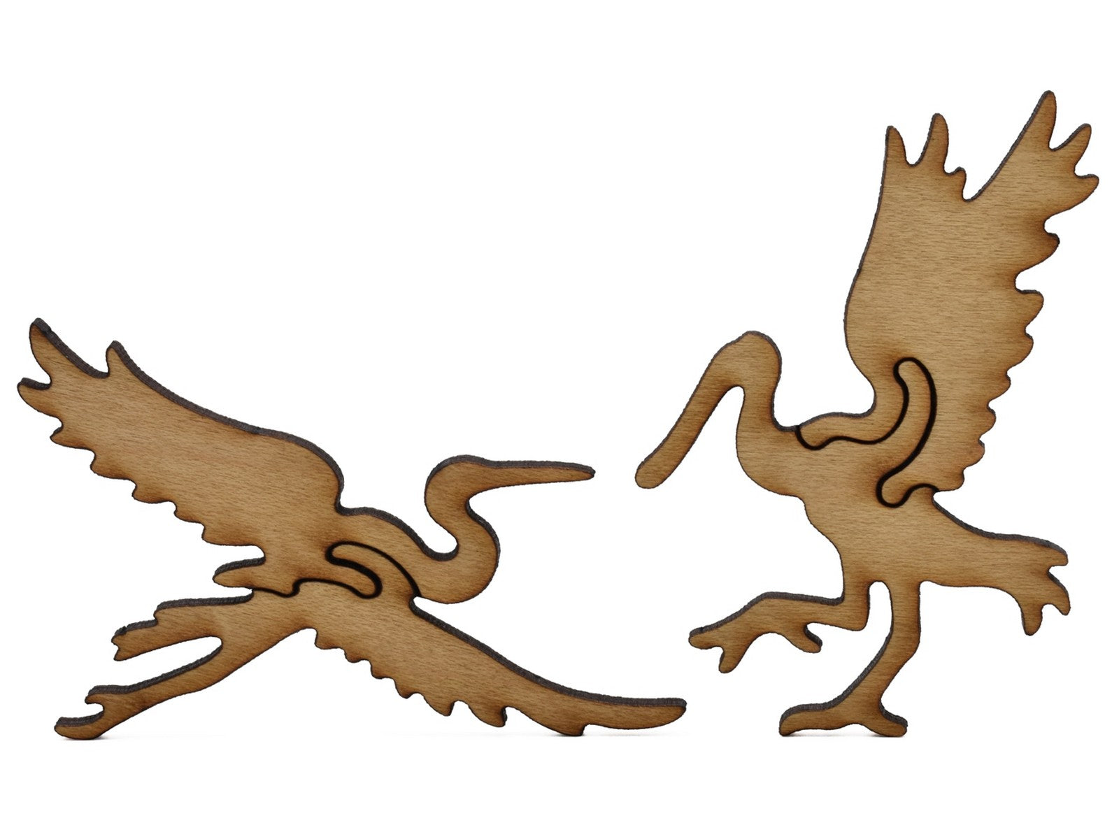 A closeup of pieces shaped like a heron and a pelican.