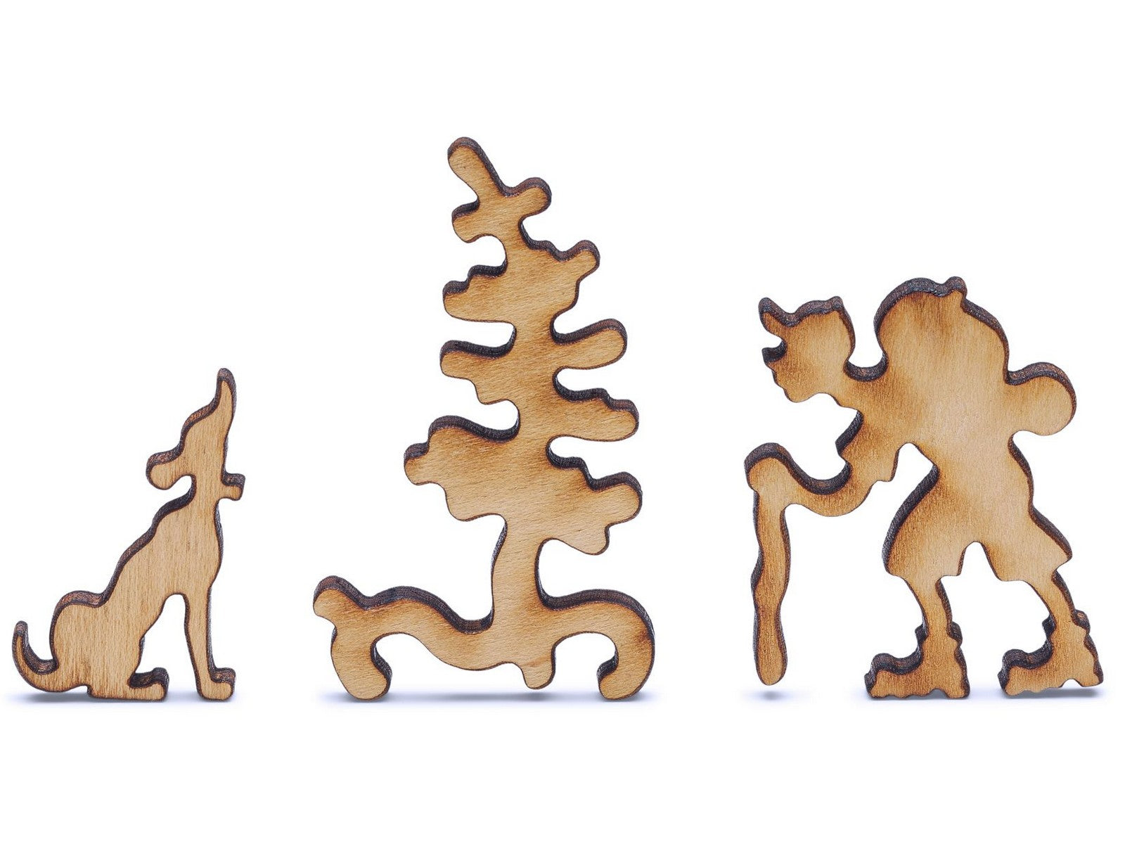 A closeup of pieces shaped like a hiker, dog, and tree.