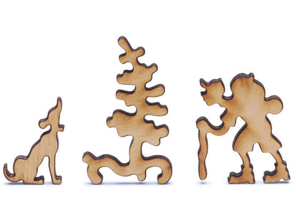 A closeup of pieces shaped like a hiker, dog, and tree.