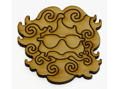 A closeup of pieces that look like a multi-piece Jerry Garcia head wearing sunglasses.