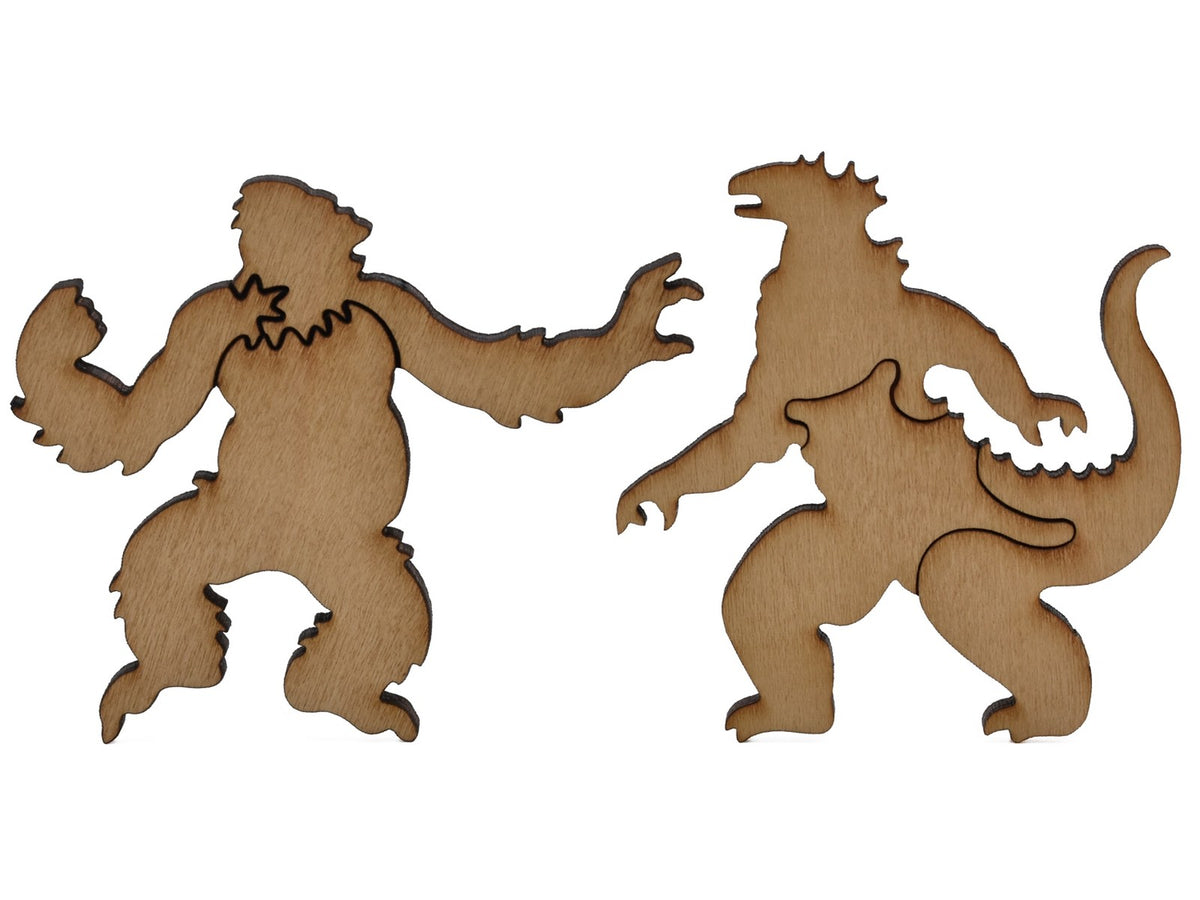 A closeup of pieces shaped like King Kong and Godzilla.