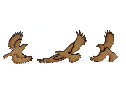 A closeup of pieces showing three birds.
