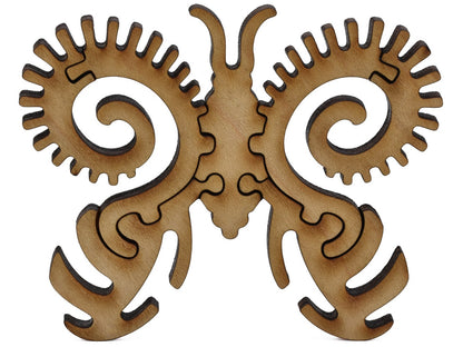 A closeup of pieces shaped like a second large butterfly.