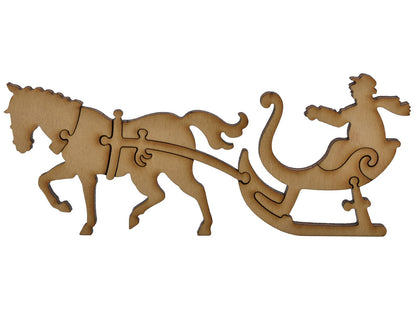 A closeup of pieces shaped like a horse and sleigh.