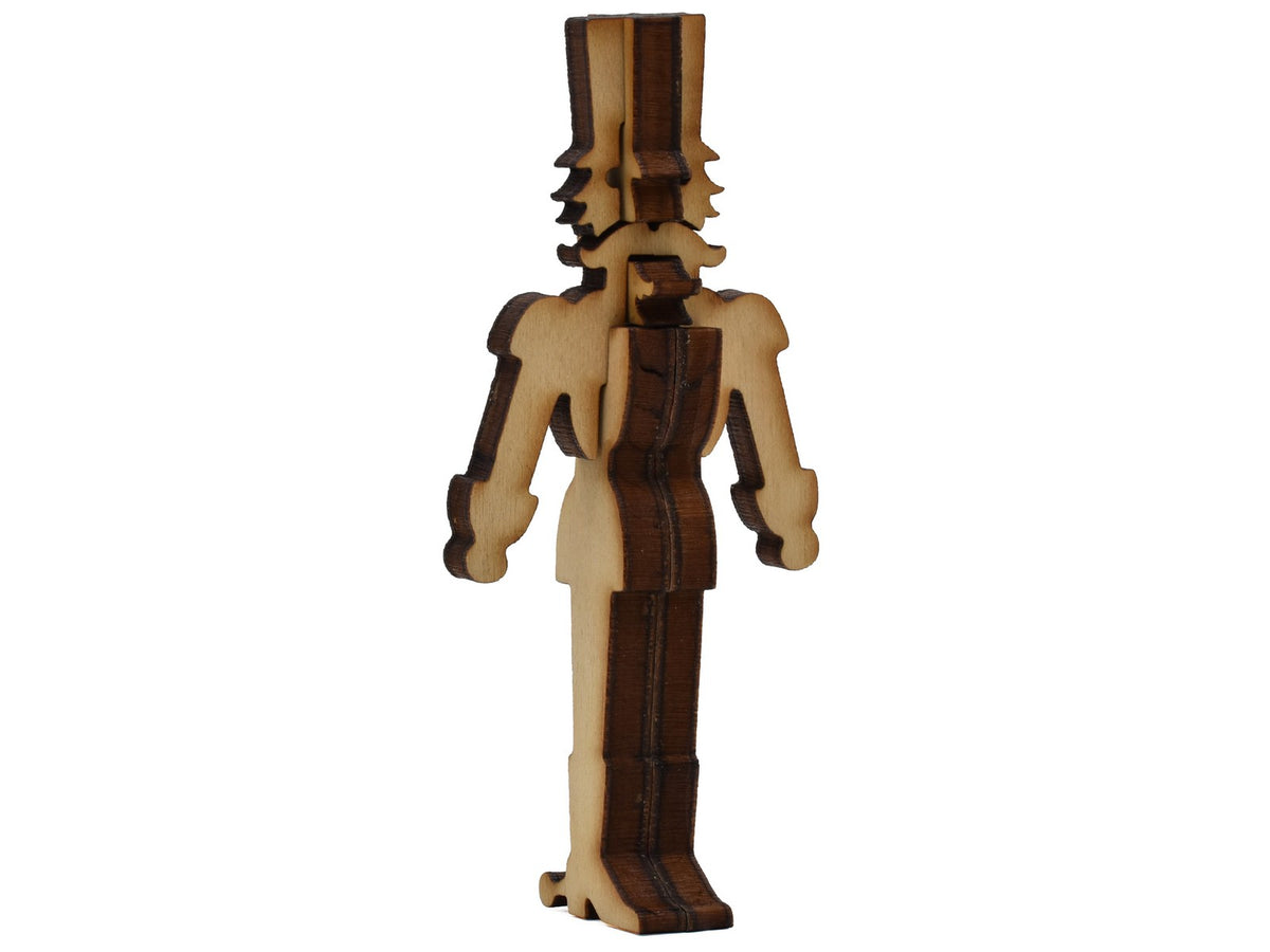 A closeup of pieces shaped like a large 3D nutcracker.