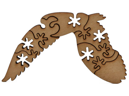 A closeup of pieces shaped like a large owl.